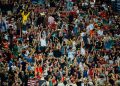 Fans celebrating in a football stadium, world cup